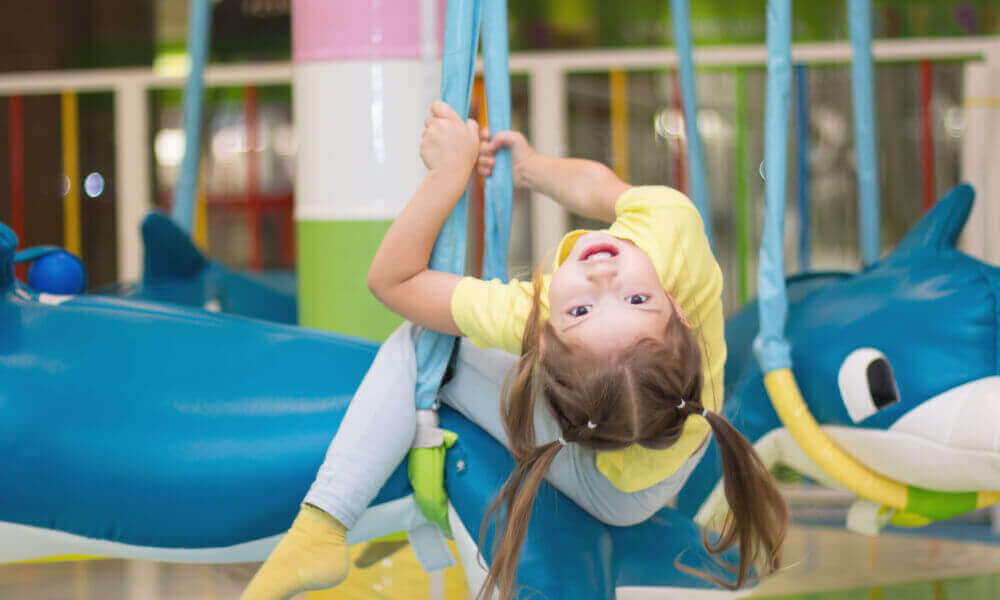 Little girl engaged in gymnastics.