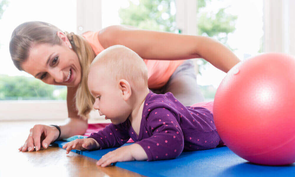 Mother and baby enjoying mat time at the Kidz Gym.